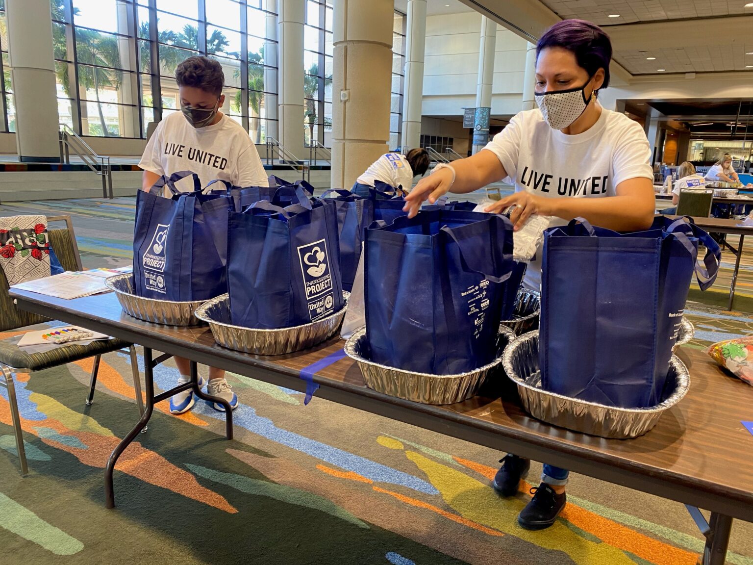 Volunteers packing thanksgiving meal kits